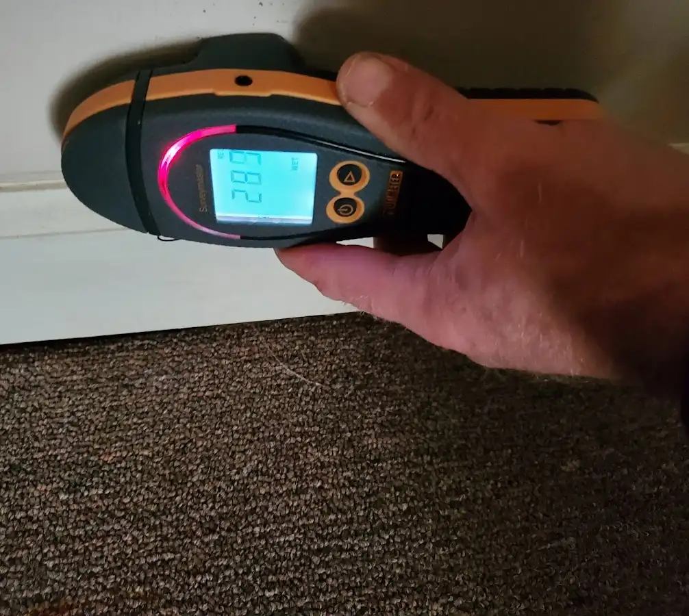 Moisture detection at baseboard during Storm Damage Restoration in Umatilla